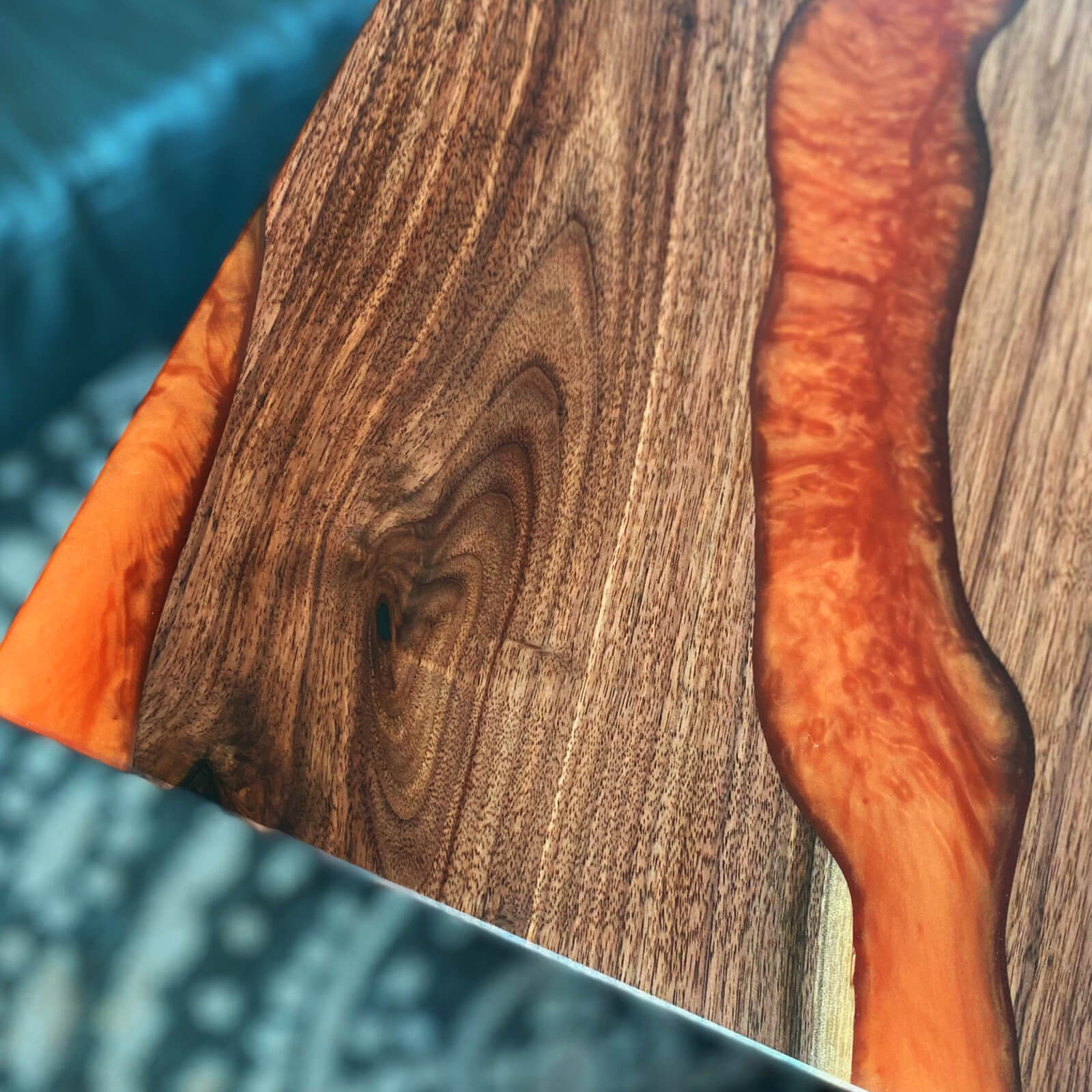 custom-black-walnut-epoxy-resin-river-table-orange-resin-era-56-65